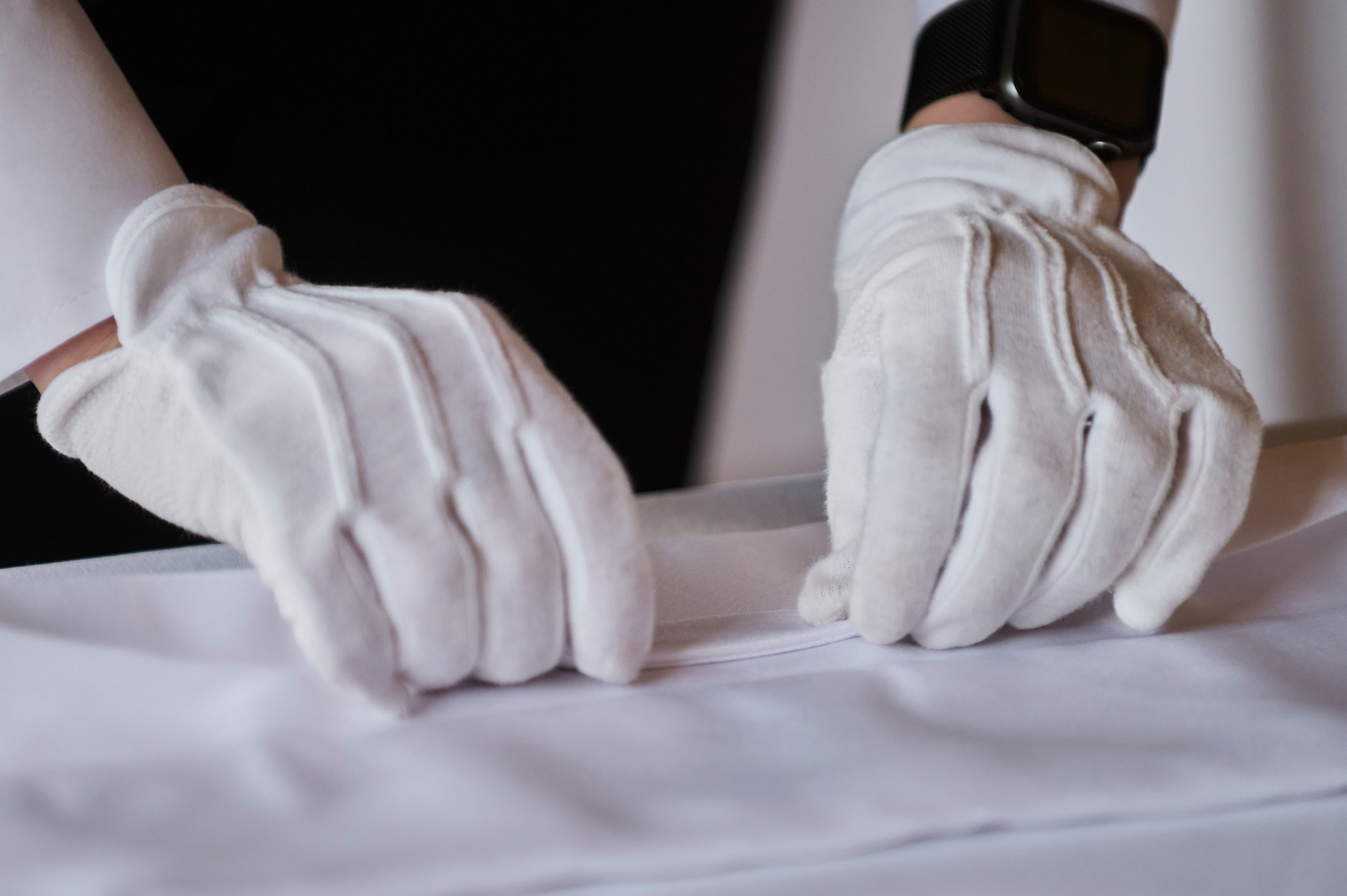 Restaurant personnel preparing the fine dining table